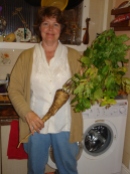 picture of author with parsnip including leafy top